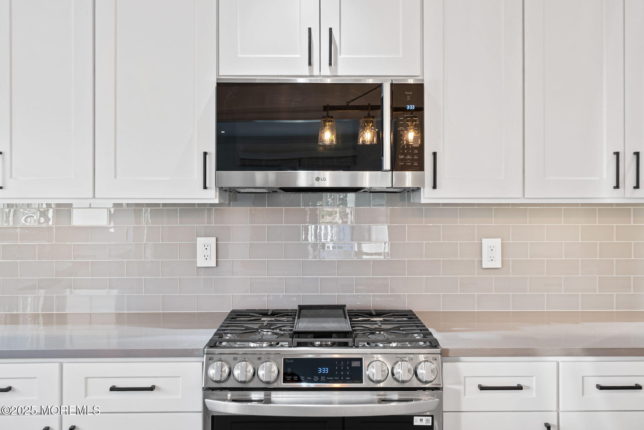 458 Newtons Corner Road Howell, NJ 07731 - Photo 6 of 44 a stove top oven sitting inside of a kitchen and white cabinets