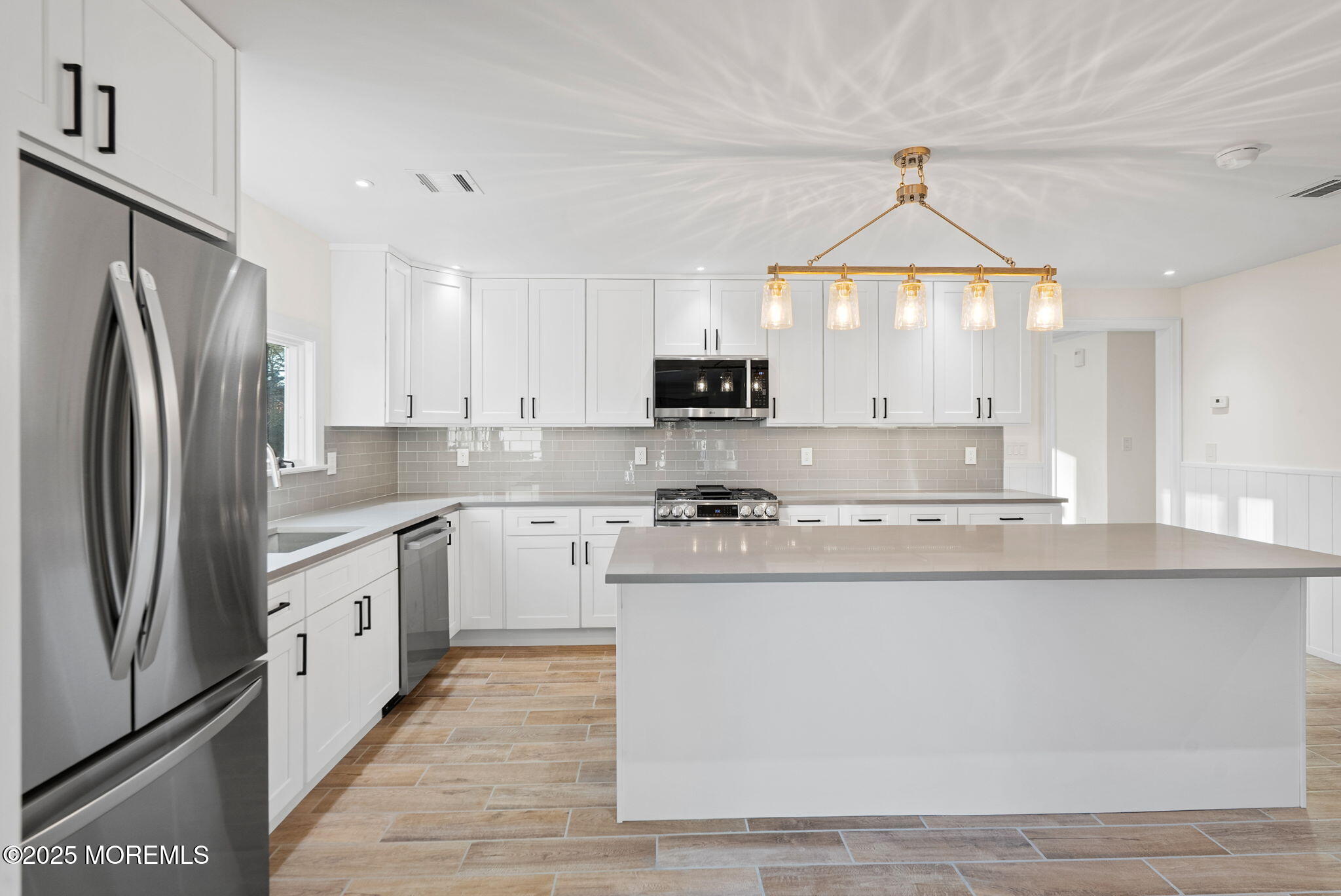 458 Newtons Corner Road Howell, NJ 07731 - Photo 8 of 44 a kitchen with stainless steel appliances granite countertop a sink a stove a refrigerator and cabinets