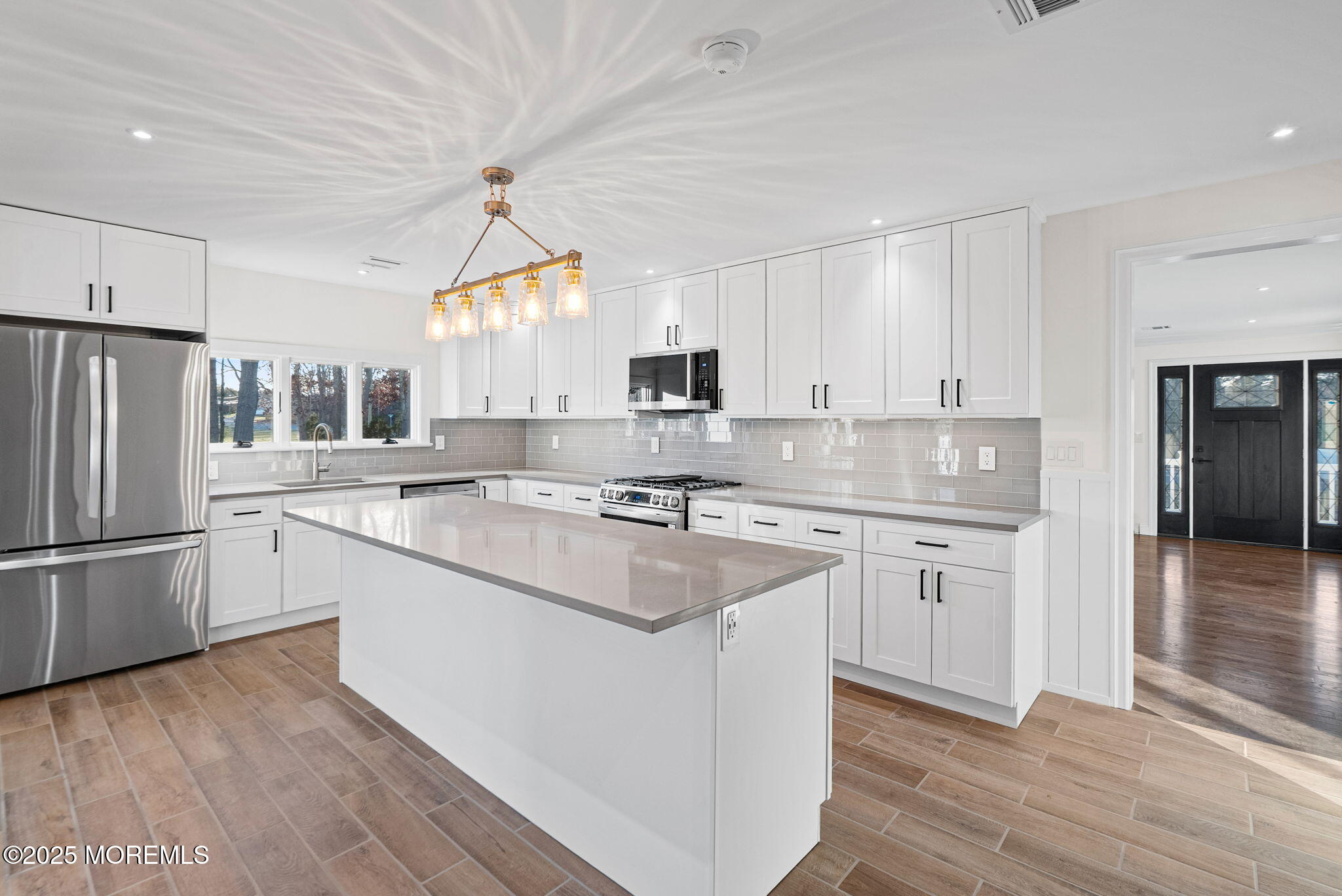 458 Newtons Corner Road Howell, NJ 07731 - Photo 9 of 44 a kitchen with granite countertop a sink stove and refrigerator