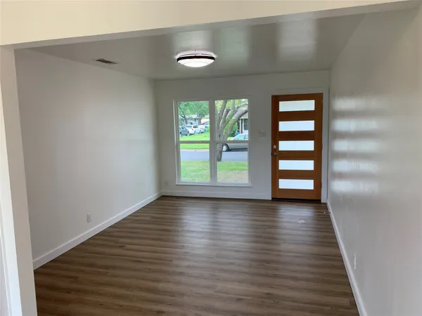 a kitchen with a refrigerator sink and stove top oven