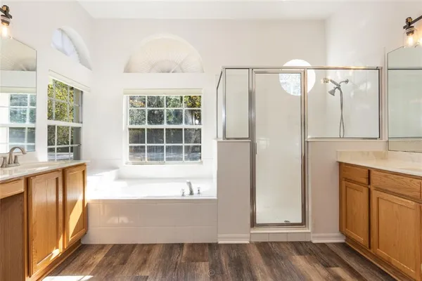 a bathroom with a bathtub and a shower