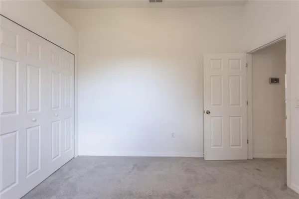 a bathroom with a sink toilet vanity and shower