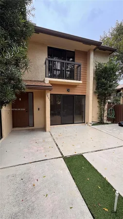a front view of a house with garage