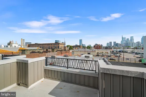 a view of a balcony with city view