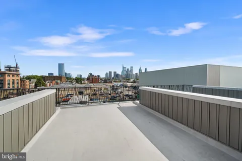 a view of a balcony with city view