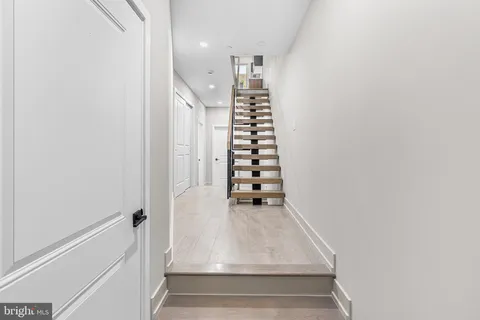 a view of entryway with wooden floor