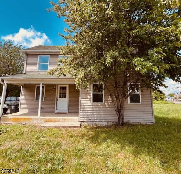 a house with swimming pool in front of it