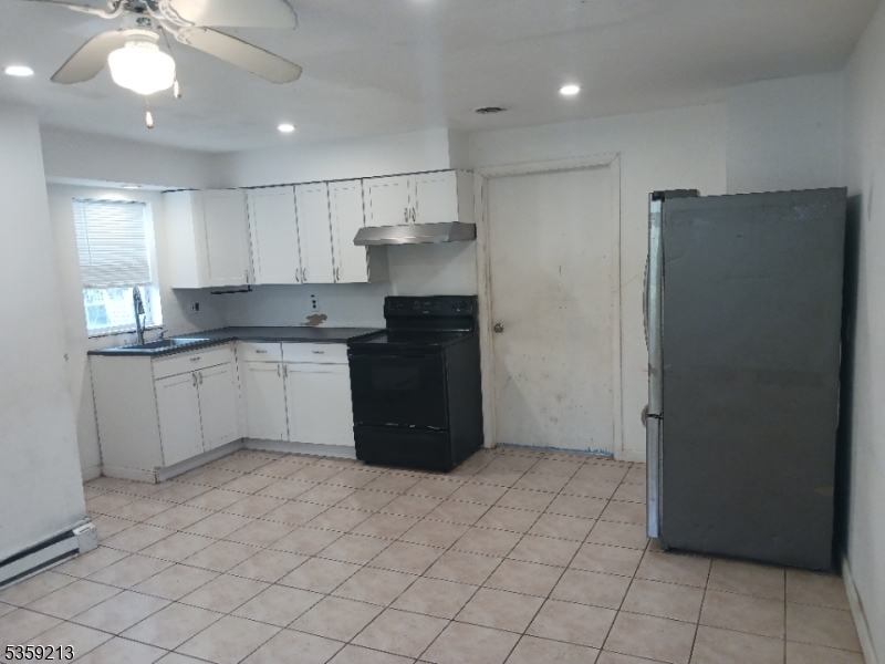 792 Paulsboro Road Swedesboro, NJ 08085 - Photo 3 of 13 a kitchen with stainless steel appliances granite countertop a refrigerator and a sink