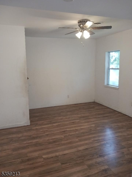 792 Paulsboro Road Swedesboro, NJ 08085 - Photo 6 of 13 wooden floor in an empty room with a window
