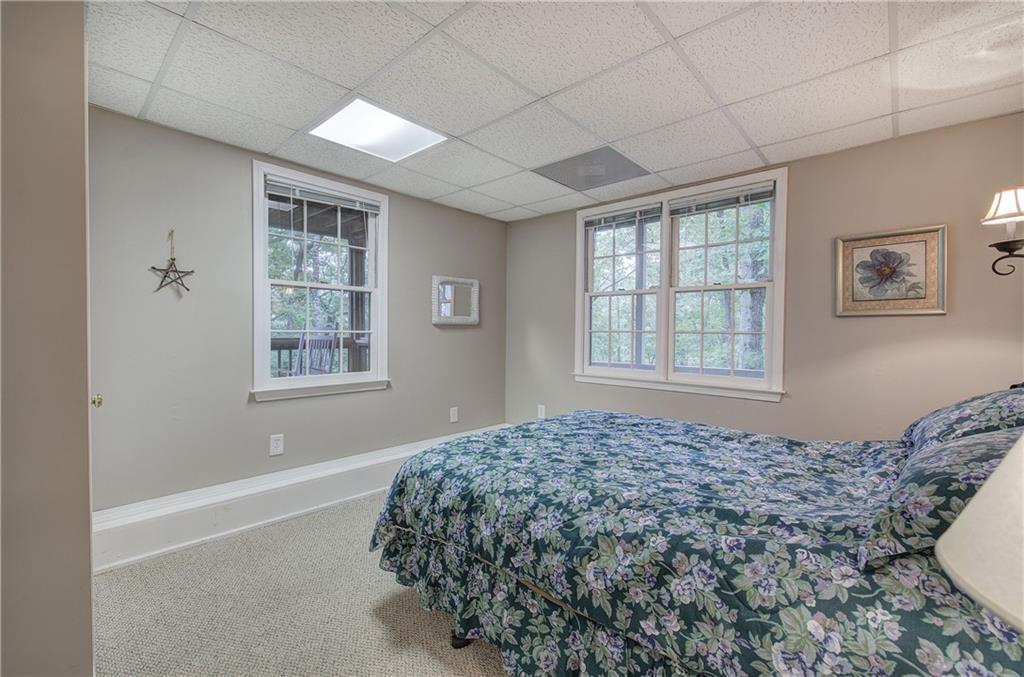 214 South View Trail Jasper, GA 30143 - Photo 33 of 72 a bed sitting in a bedroom next to a window