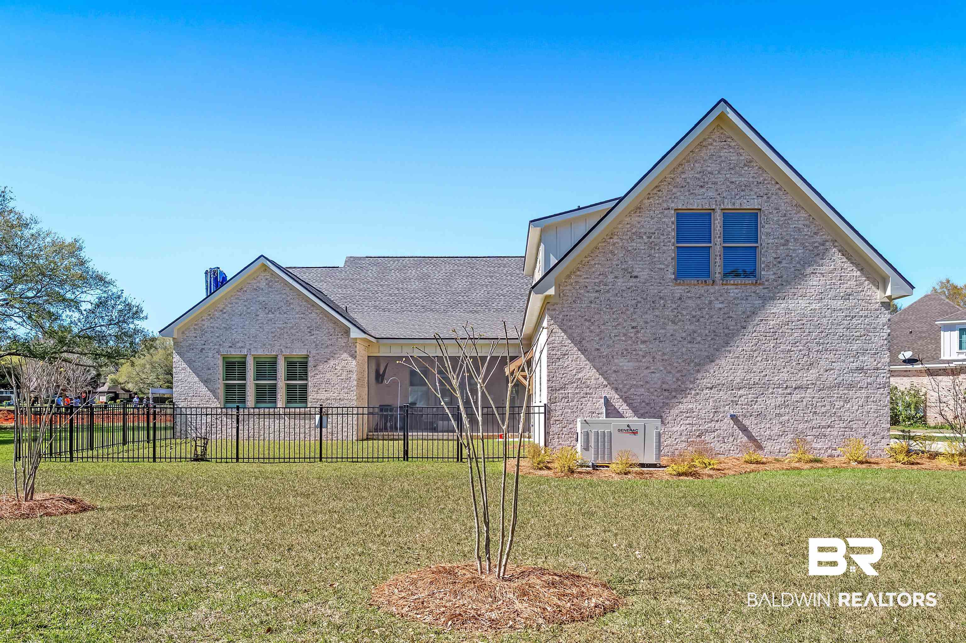9144 Harvest Ridge Fairhope, AL 36532 - Photo 13 of 58 Back of property featuring a lawn, brick siding, and fence