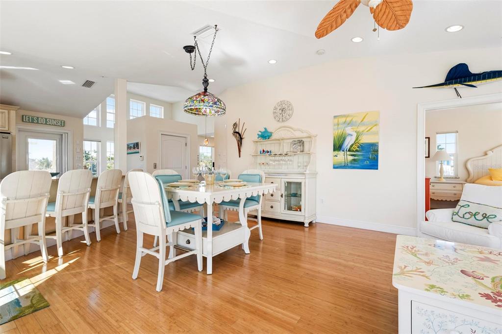 106 79th Street Holmes Beach, FL 34217 - Photo 20 of 98 a view of a dining room with furniture and wooden floor
