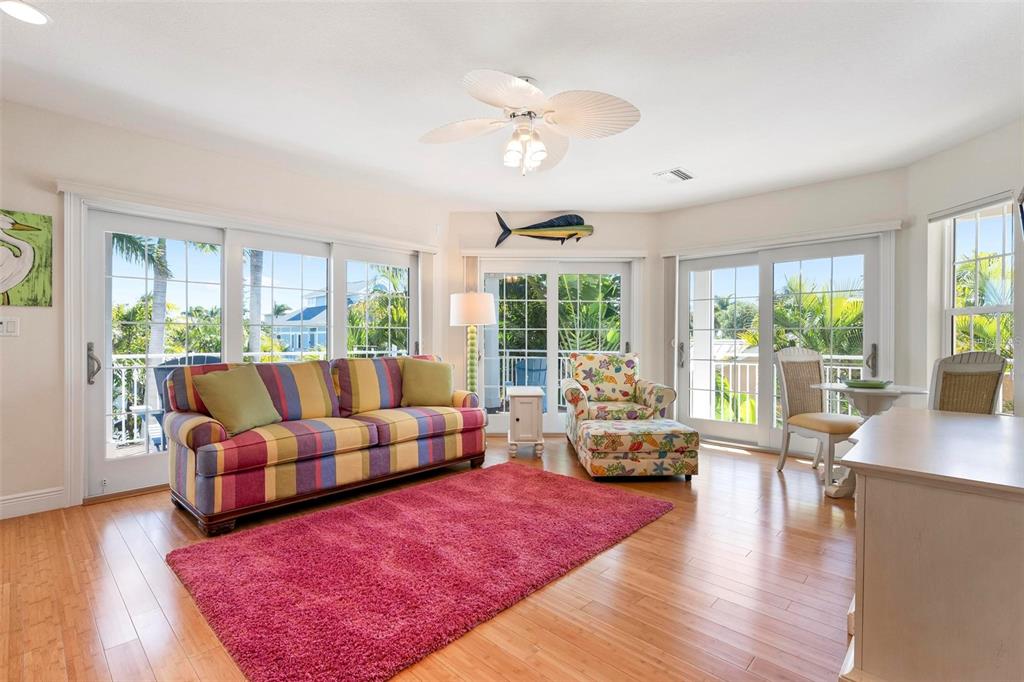 106 79th Street Holmes Beach, FL 34217 - Photo 30 of 98 a living room with furniture and a large window
