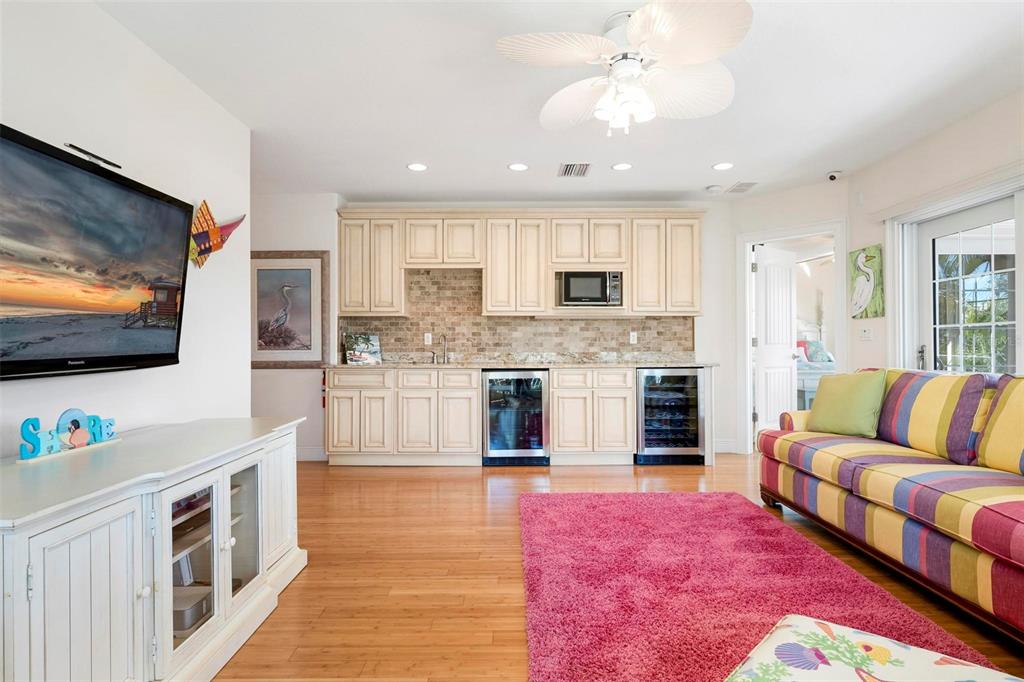 106 79th Street Holmes Beach, FL 34217 - Photo 33 of 98 a living room with furniture and a flat screen tv