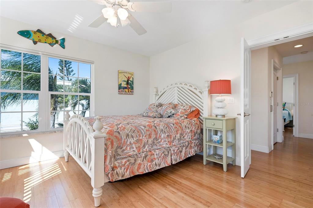 106 79th Street Holmes Beach, FL 34217 - Photo 47 of 98 a bedroom with a bed and a window