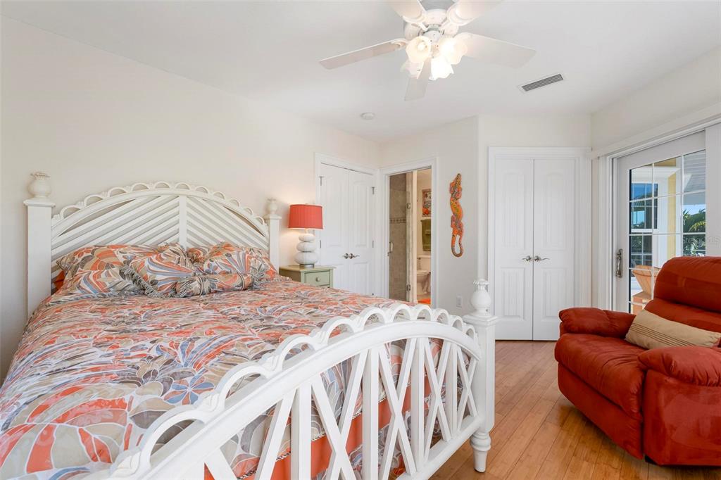 106 79th Street Holmes Beach, FL 34217 - Photo 48 of 98 a bedroom with a bed and a couch