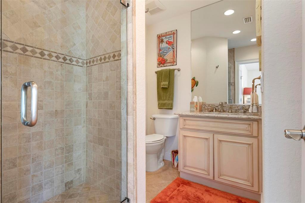 106 79th Street Holmes Beach, FL 34217 - Photo 49 of 98 a bathroom with a sink a toilet and shower