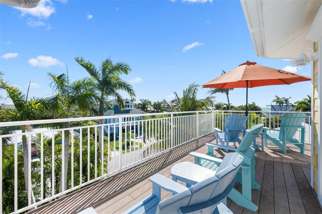 106 79th Street Holmes Beach, FL 34217 - Photo 52 of 98 a view of a balcony with lake view and wooden floor