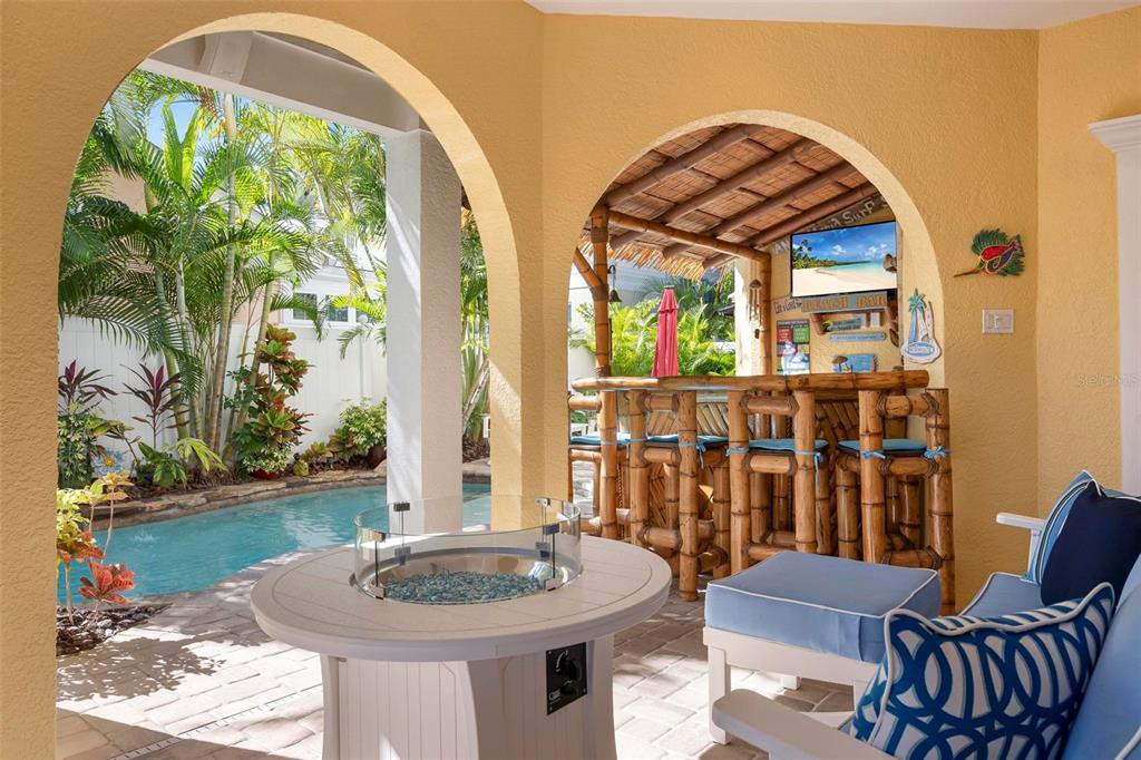 106 79th Street Holmes Beach, FL 34217 - Photo 65 of 98 a dining room with furniture and wooden floor