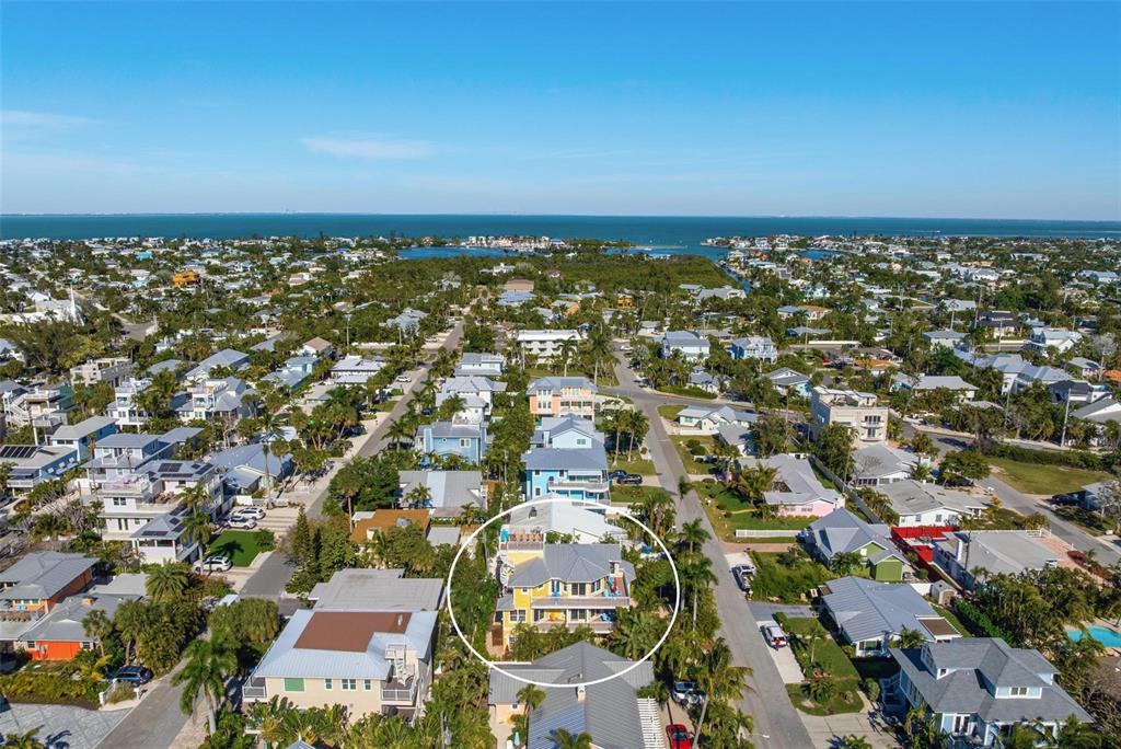 106 79th Street Holmes Beach, FL 34217 - Photo 93 of 98 an aerial view of residential building with parking space