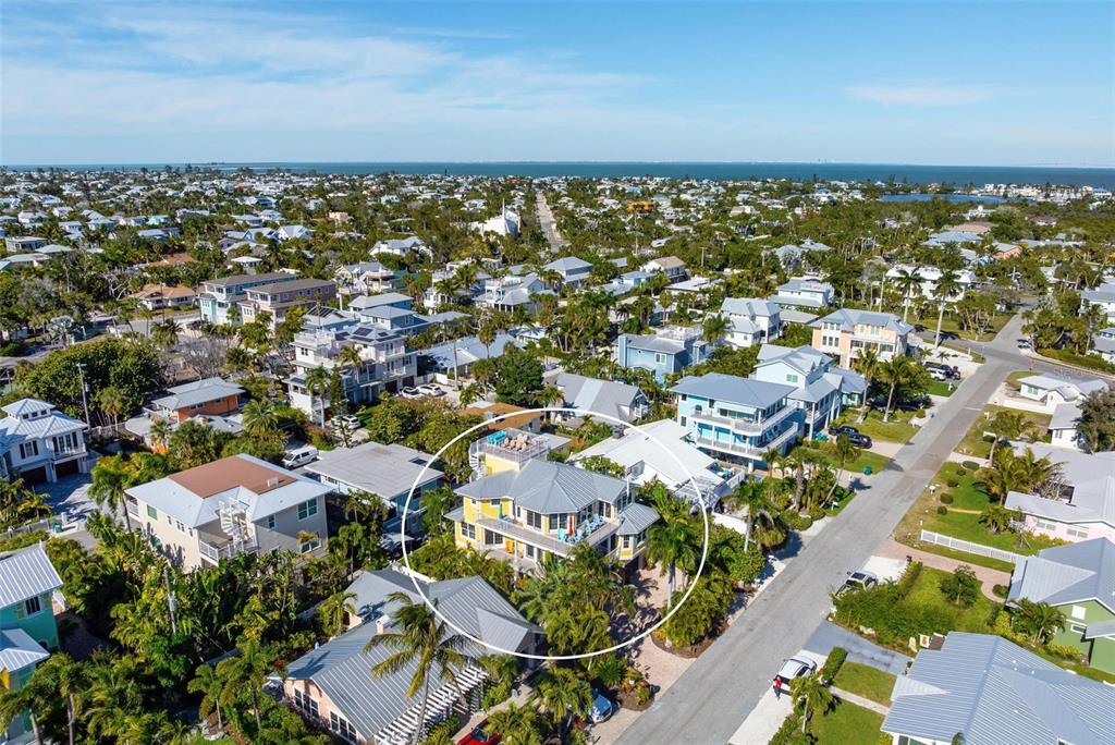 106 79th Street Holmes Beach, FL 34217 - Photo 94 of 98 an aerial view of residential building with parking space