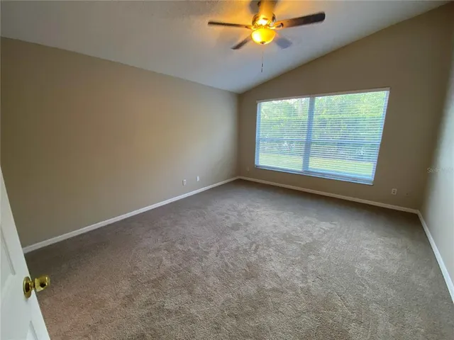 a bathroom with a tub shower and sink