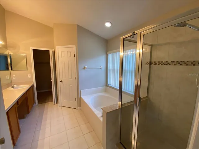 a bathroom with a tub and a shower