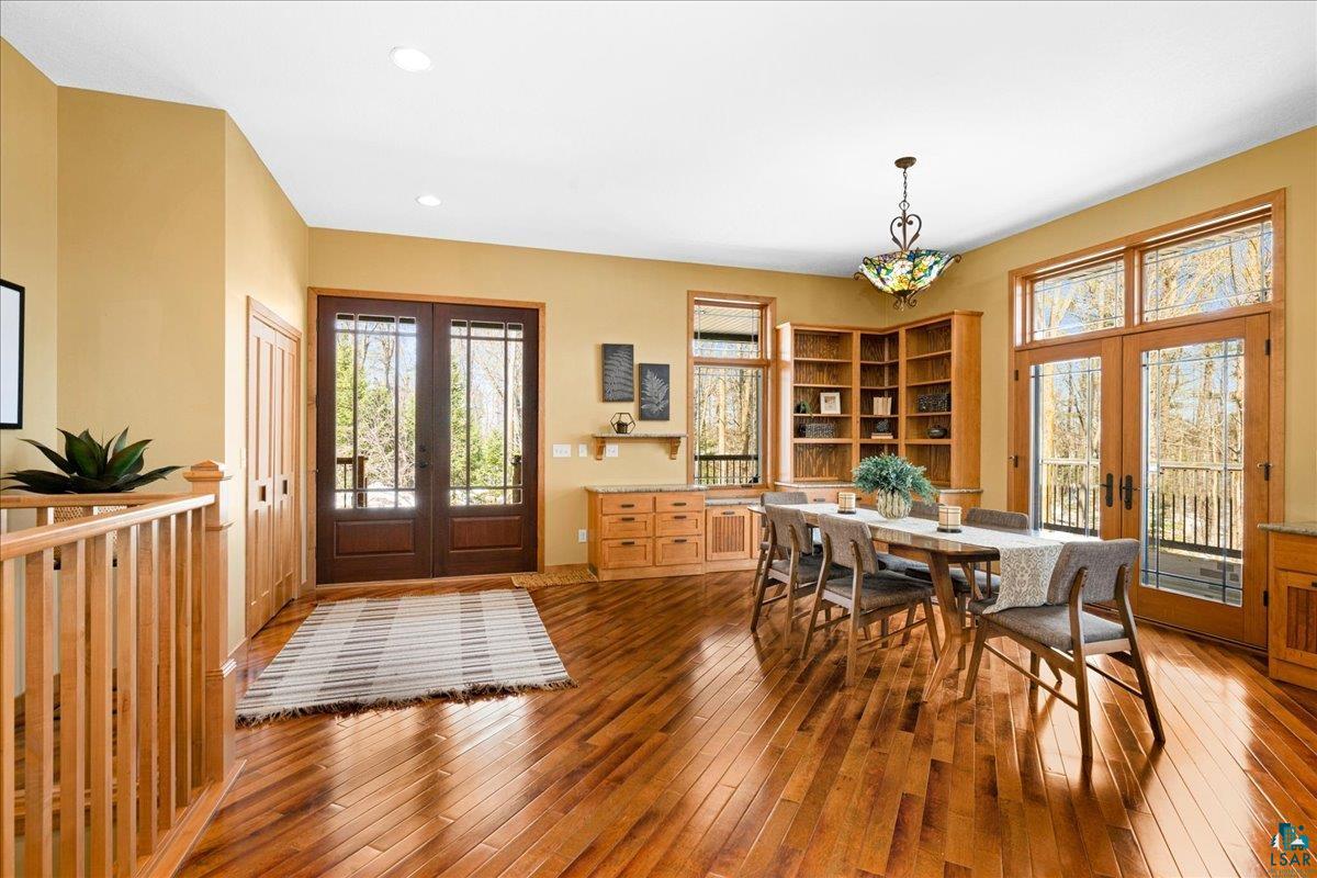 92598 Spells Road Sturgeon Lake, MN 55783 - Photo 12 of 60 Dining area featuring french doors, dark wood-style floors, and recessed lighting