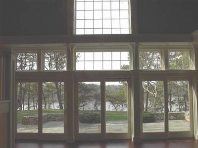 Undisclosed Address Marstons Mills, MA 02648 - Photo 4 of 11 a view of an empty room with a large window