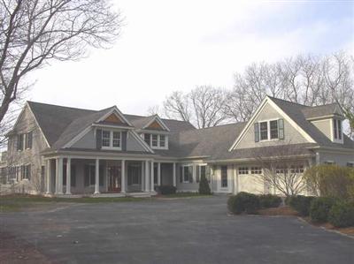 Undisclosed Address Marstons Mills, MA 02648 - Photo 8 of 11 a front view of a house with a garden