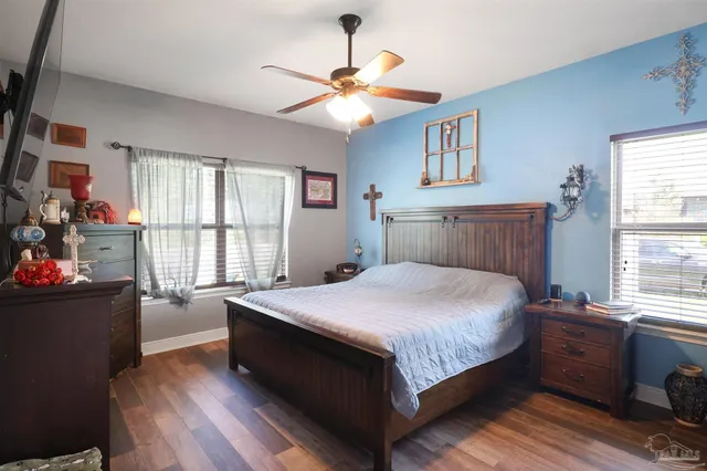 a view of a hallway to a livingroom with furniture