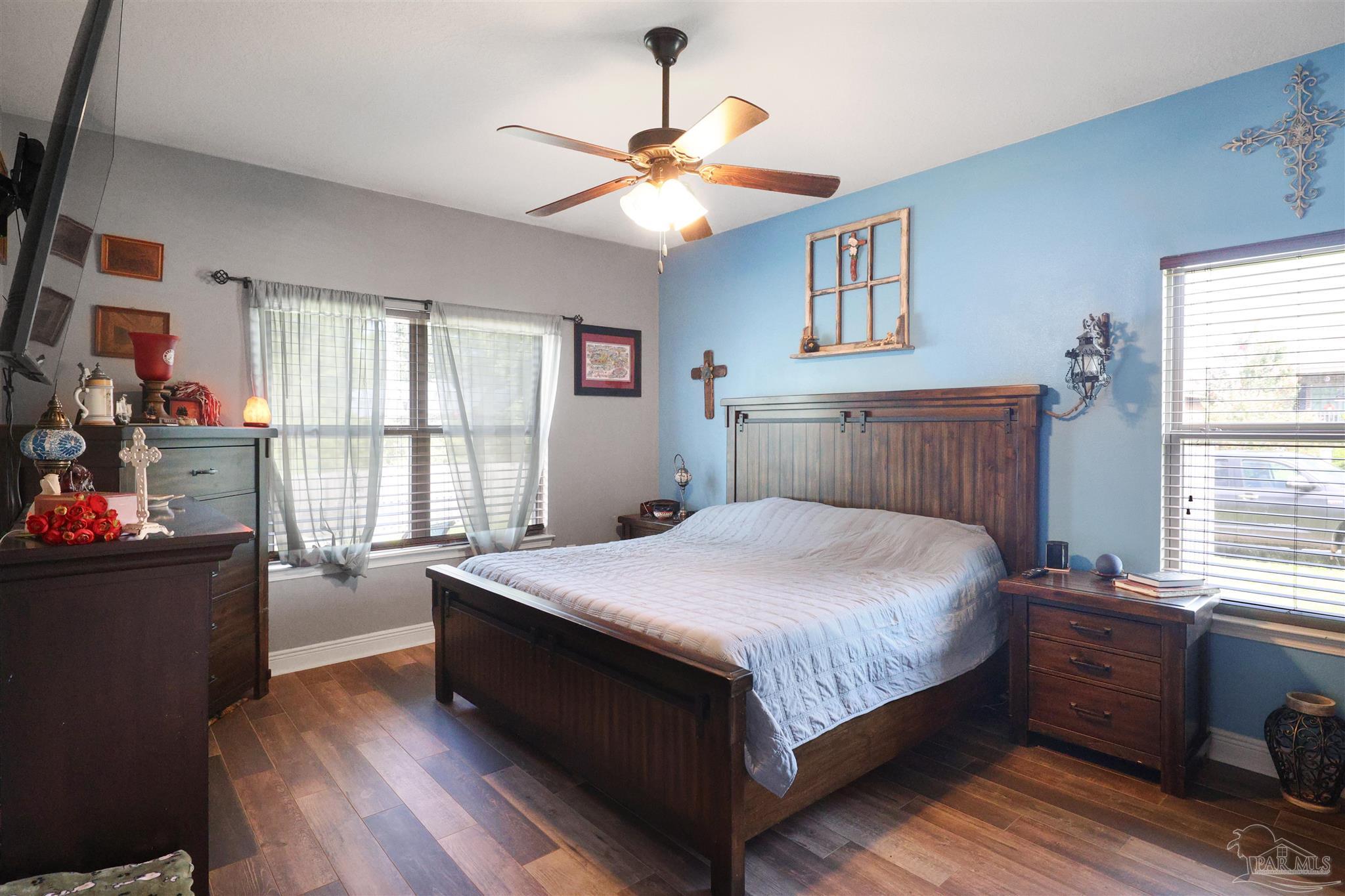 6377 Ladera Trail Pace, FL 32571 - Photo 13 of 38 a bedroom with a bed and a window