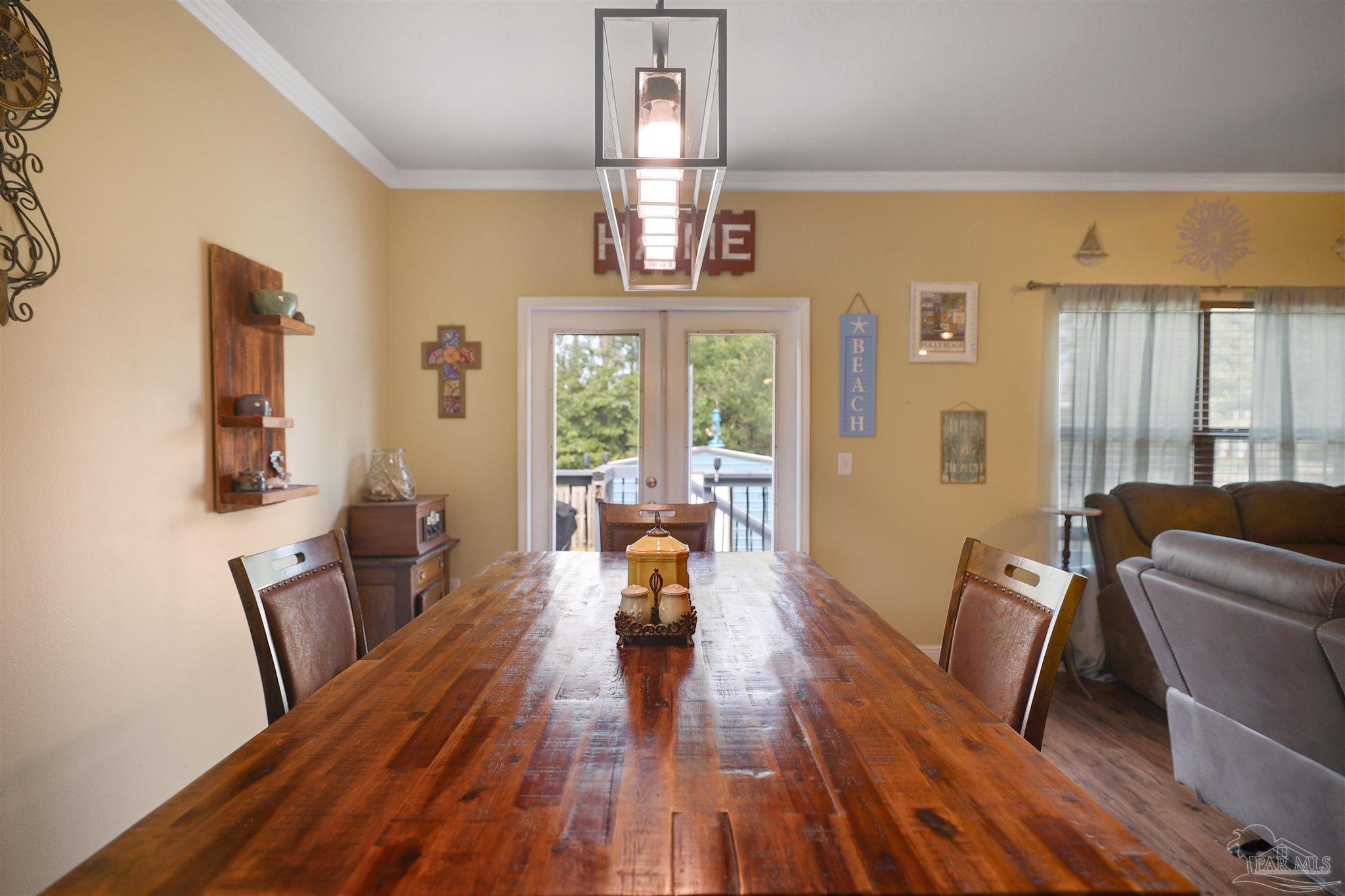 6377 Ladera Trail Pace, FL 32571 - Photo 25 of 38 a living room with furniture and a large window
