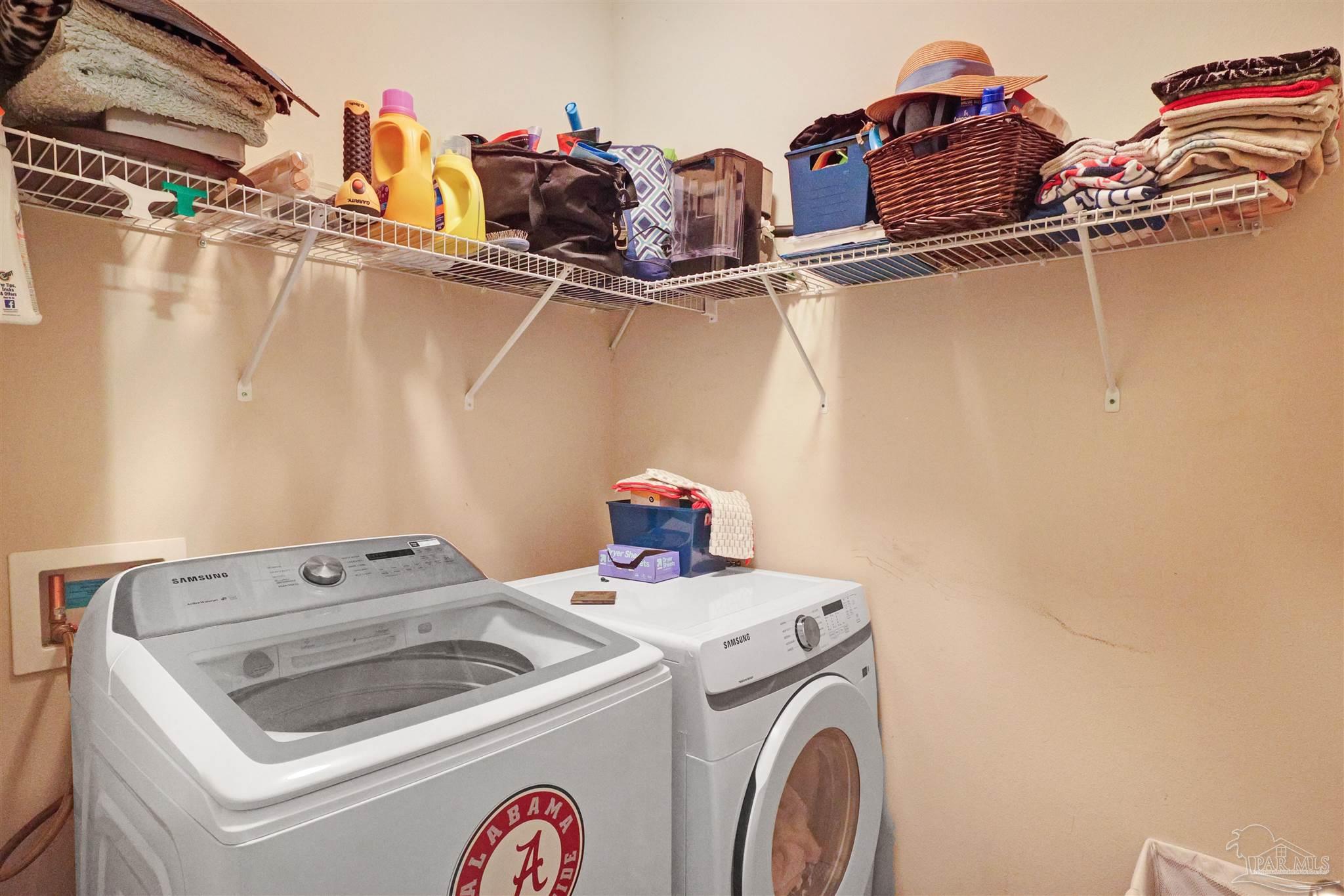 6377 Ladera Trail Pace, FL 32571 - Photo 27 of 38 a utility room with dryer and washer