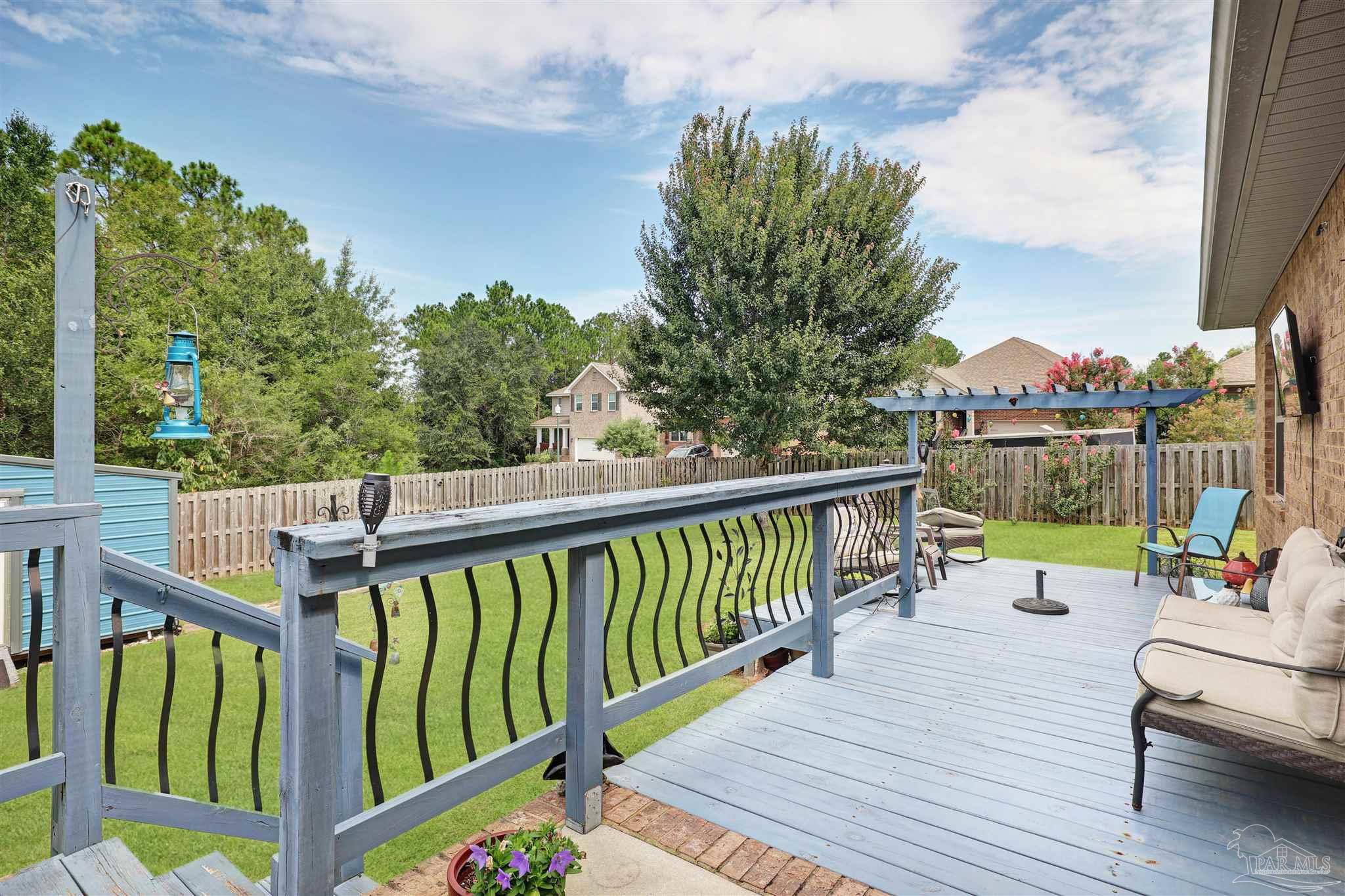 6377 Ladera Trail Pace, FL 32571 - Photo 28 of 38 a view of a two chairs on the roof deck
