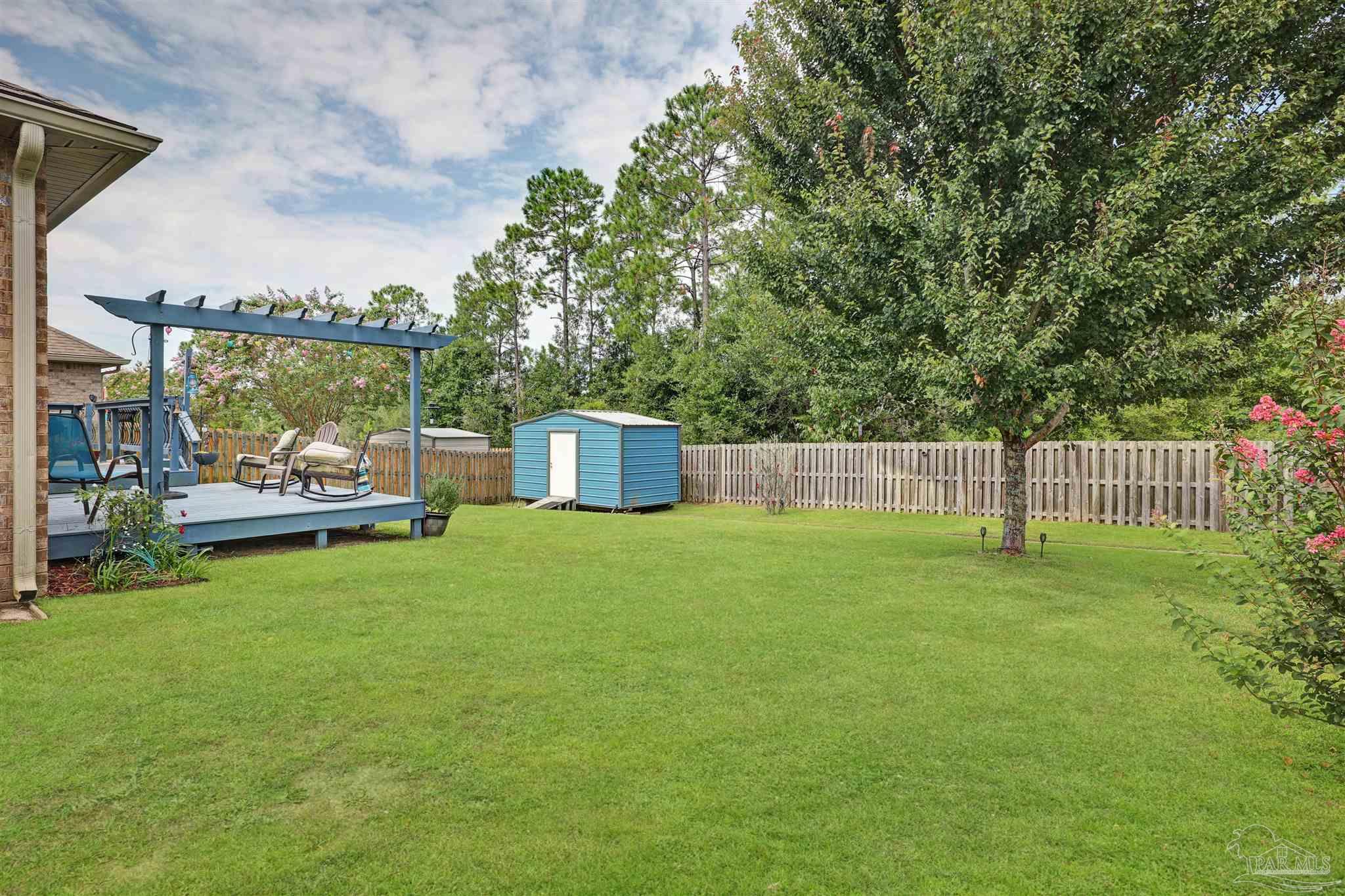 6377 Ladera Trail Pace, FL 32571 - Photo 30 of 38 a garden view