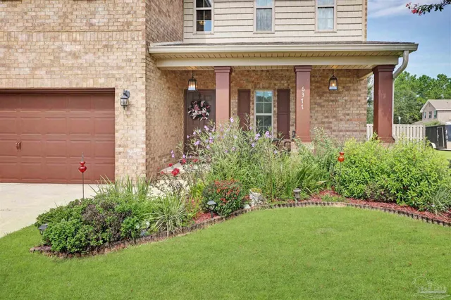 front view of a house with a yard