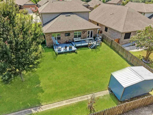 a view of a back yard of the house
