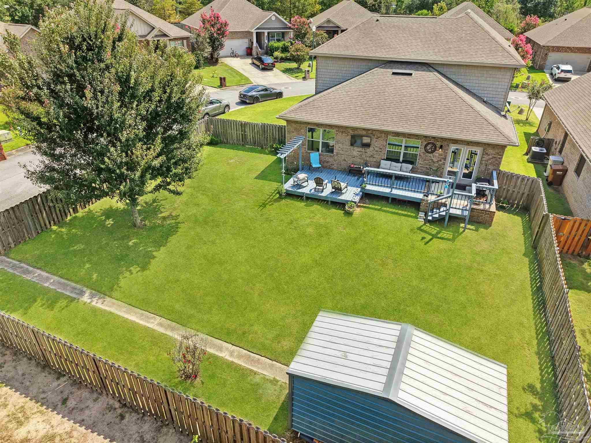 6377 Ladera Trail Pace, FL 32571 - Photo 34 of 38 an aerial view of a house with swimming pool having outdoor seating
