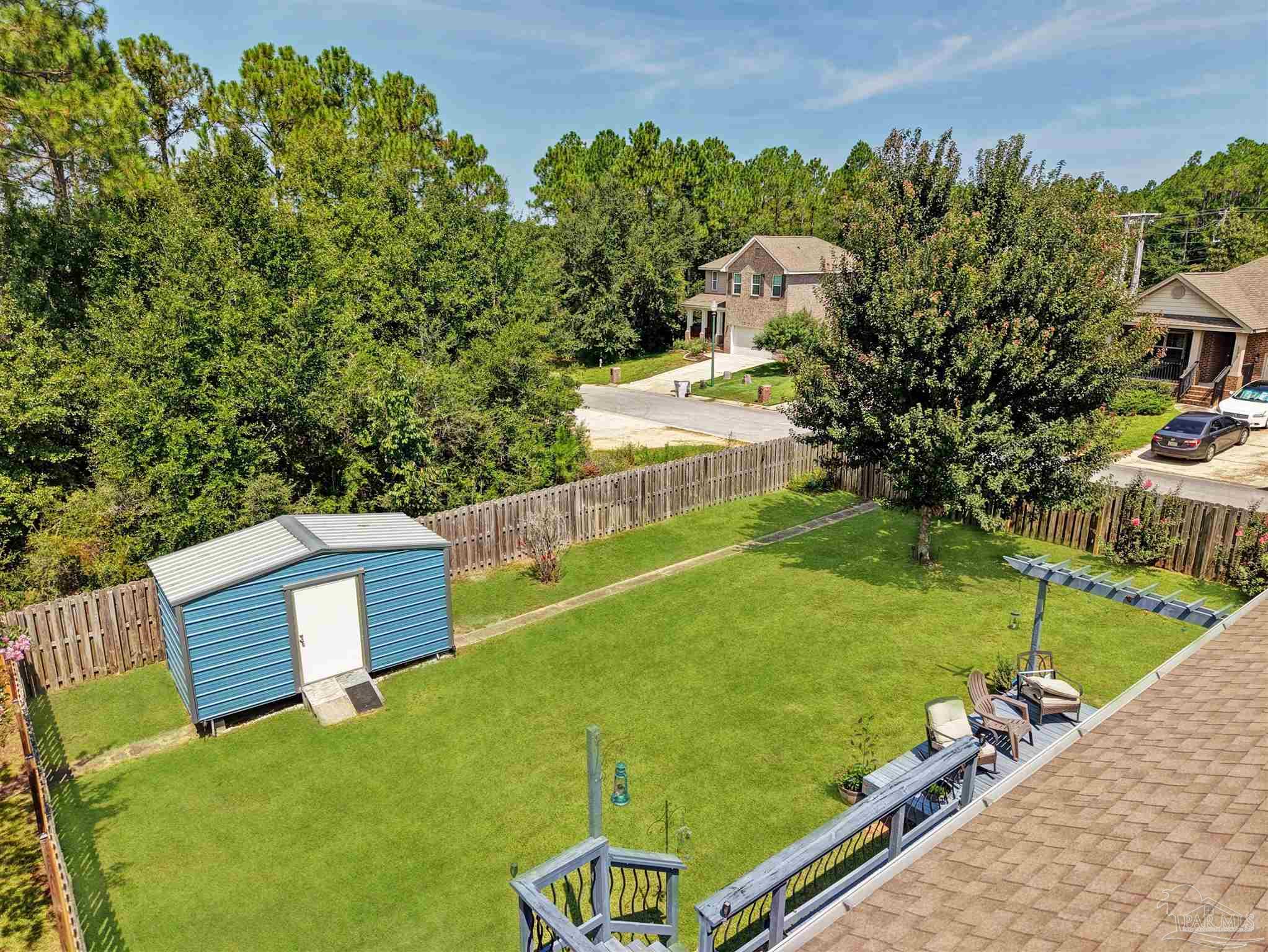 6377 Ladera Trail Pace, FL 32571 - Photo 35 of 38 a view of a back yard of the house