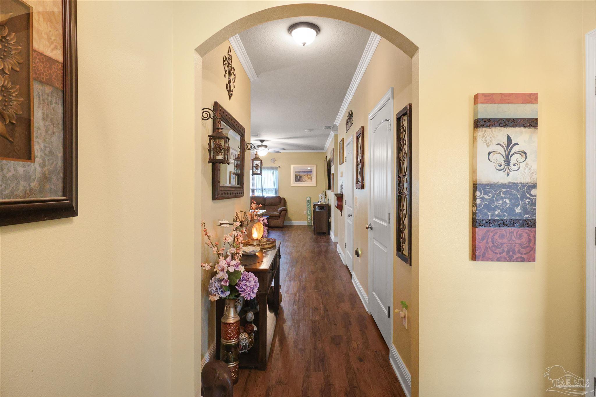 6377 Ladera Trail Pace, FL 32571 - Photo 4 of 38 a view of a hallway with entryway to a livingroom