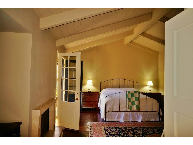 139 Littlefield Road Monterey, CA 93940 - Photo 11 of 18 a bedroom with a bed and wooden floor