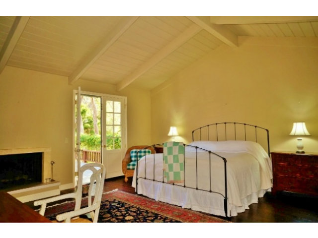 139 Littlefield Road Monterey, CA 93940 - Photo 8 of 18 a bedroom with a bed and wooden floor