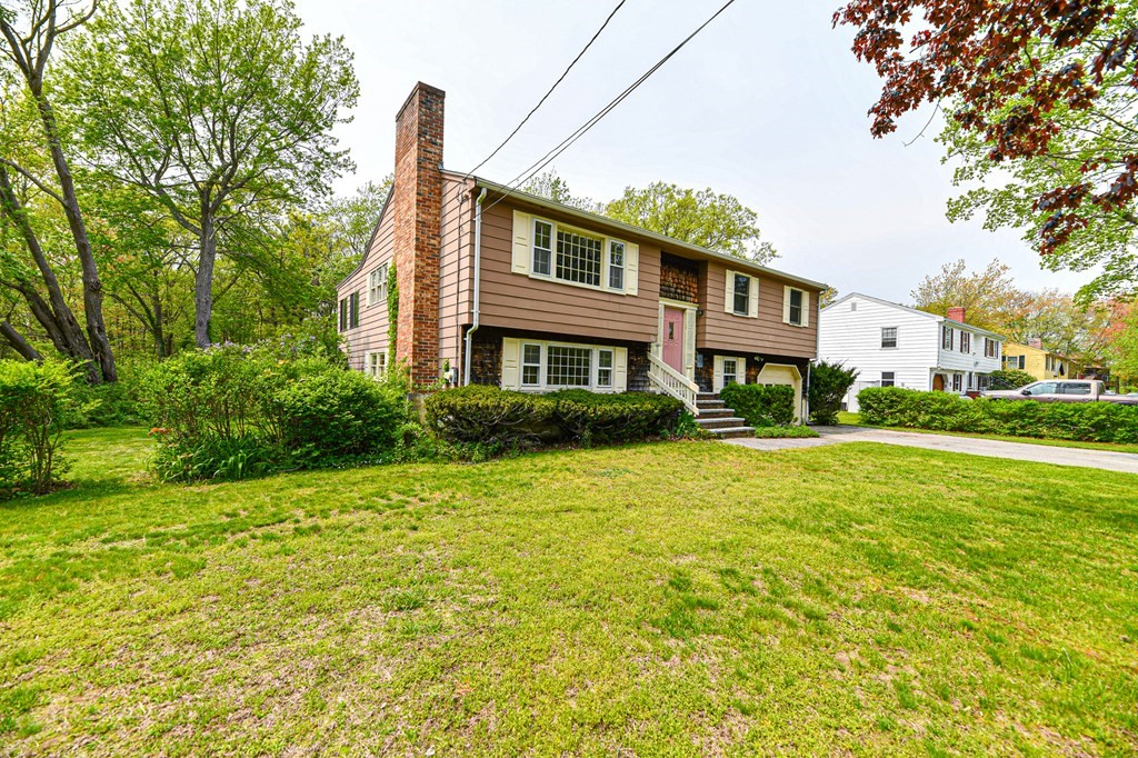 122 Ferry Road Salisbury, MA 01952 - Photo 3 of 40 a front view of a house with a garden