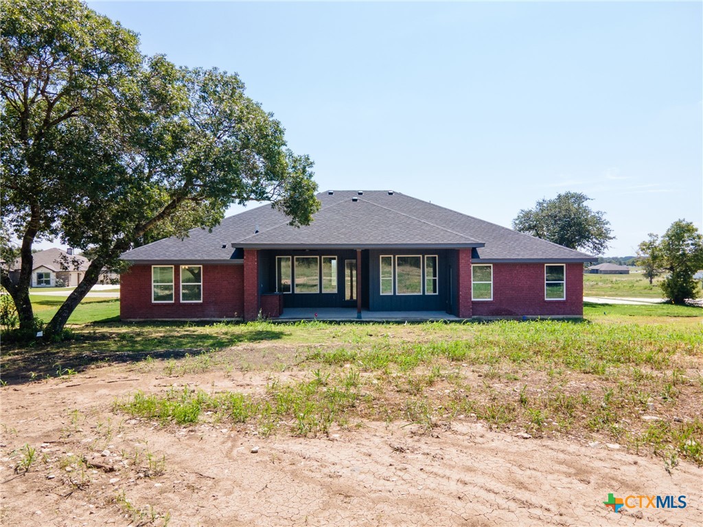 3025 Millhouse Road Copperas Cove, TX 76522 - Photo 32 of 38 a brick house with trees in front of it