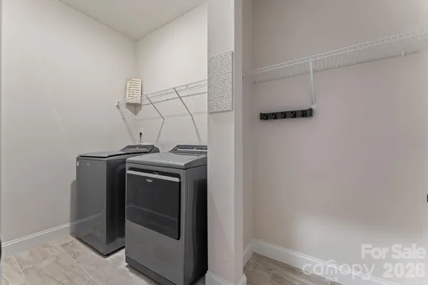 a view of storage and utility room with washer and dryer