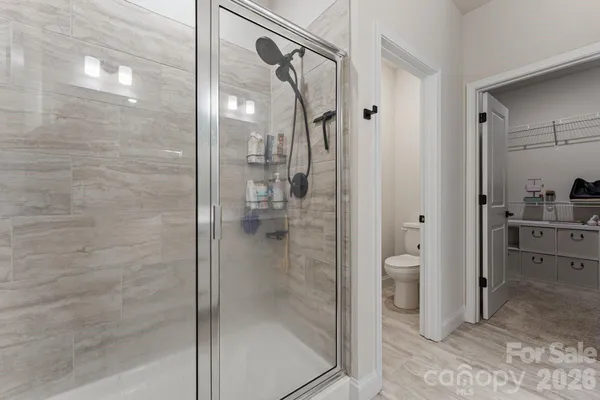 a bathroom with a granite countertop shower mirror and a sink
