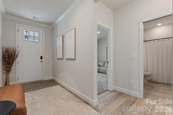 an empty room with closet and mirror