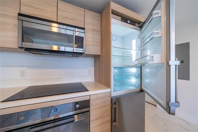 a view of a hallway with washer and dryer