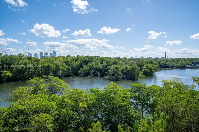 a view of a lake in middle of lake and houses with outdoor space